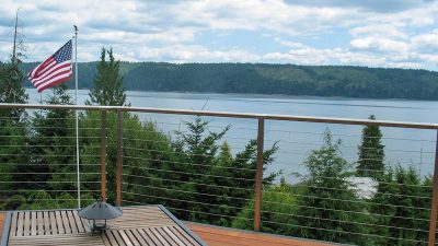 Deck cable railing Hoodsport WA. AGS Stainless prefabricated the Hoodsport cable rail for the homeowner—the WA railing company ships products all over the US and beyond, including cable rail, glass, and stainless rod railing,