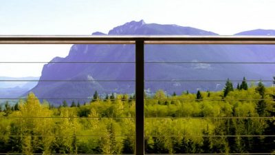 This North Bend deck cable rail looks beautiful. Perfect for a Washington state deck railing remodel. The North Bend stainless deck rail homeowner selected a modern railing system.