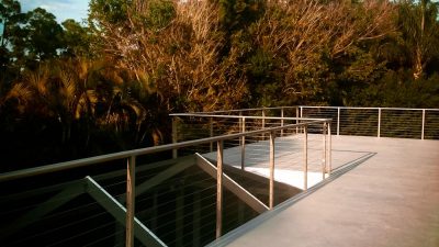 A homeowner installed this modern Florida deck cable railing system as part of a deck remodel project. The Jupiter stainless deck railing is perfect for humid locations because AGS manufactures all indoor and outdoor railing systems from corrosion-resistant 316 stainless steel.