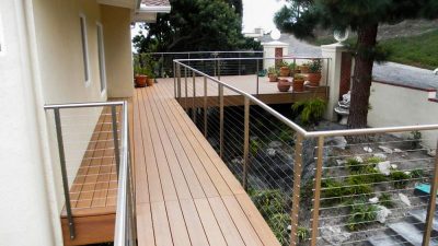 The developer of this residential railing project installed a staircase cable rail, deck railing, and balcony railing at the same location.