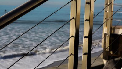 This Ventura cable deck rail is marine-grade stainless steel, perfect for a coastal California deck rail remodel project.