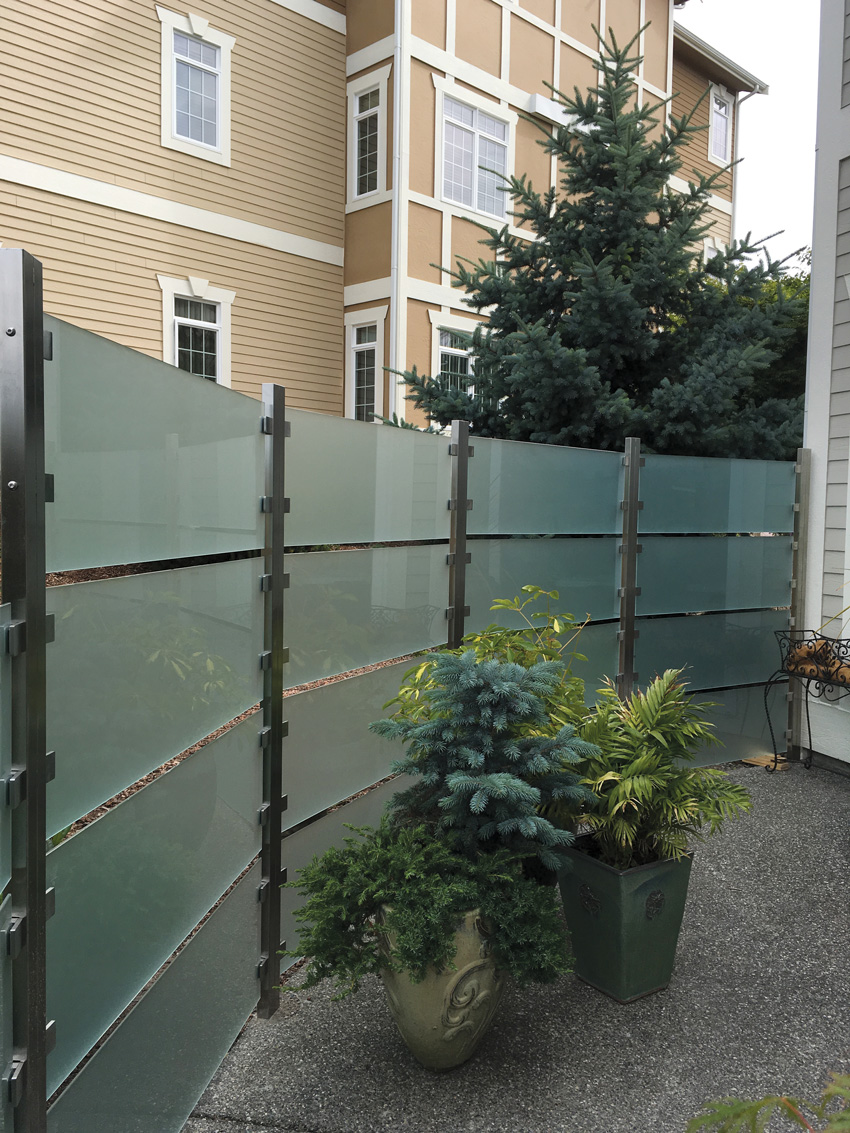 Photo of an outdoor space with glass partition.