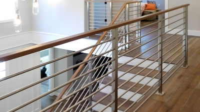 This homeowner chose the same modern stainless handrail for the staircase and balcony railing. The Menlo Park, CA, railing remodel looks incredible.