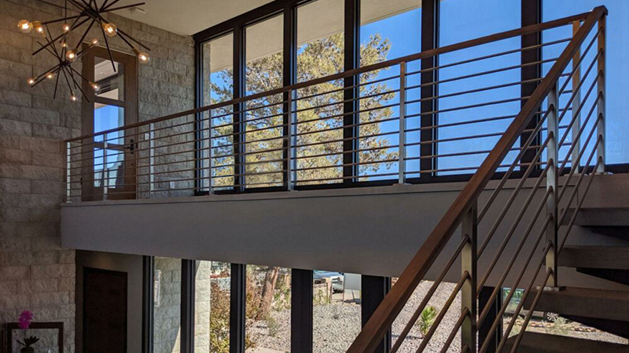 Stainless railings for stairs with cable.