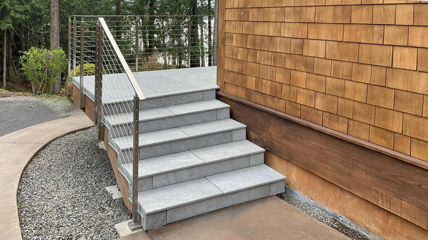 Modern deck stair handrail design.