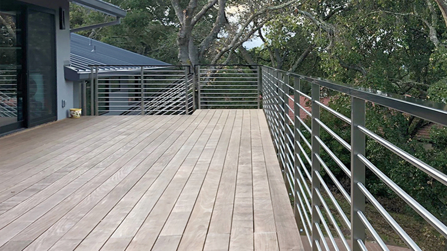 Brushed bar railing on a deck