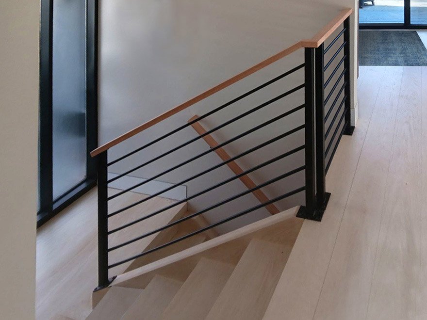 Stainless steel railings for stairs with powder coat black infill are often referred to as wrought iron railings.