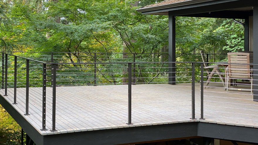 Black stainless steel railings with cable infill.