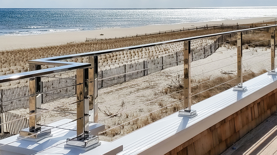Shiney stainless railing system with wire infill. Luxurious mirror finish on railing system.
