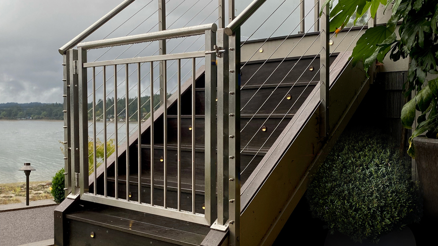 Beautiful stainless gate for stair railing system.
