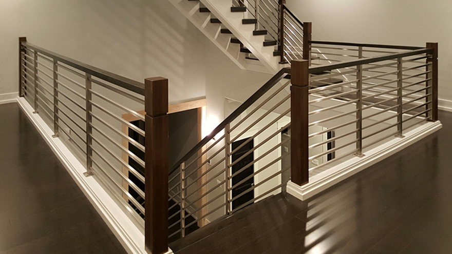 Horizontal railing with a traditional look staircase design