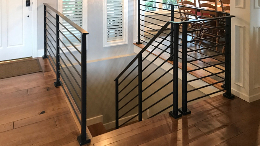 Black horizontal home railing system. Black stair rail with top mount railing posts.