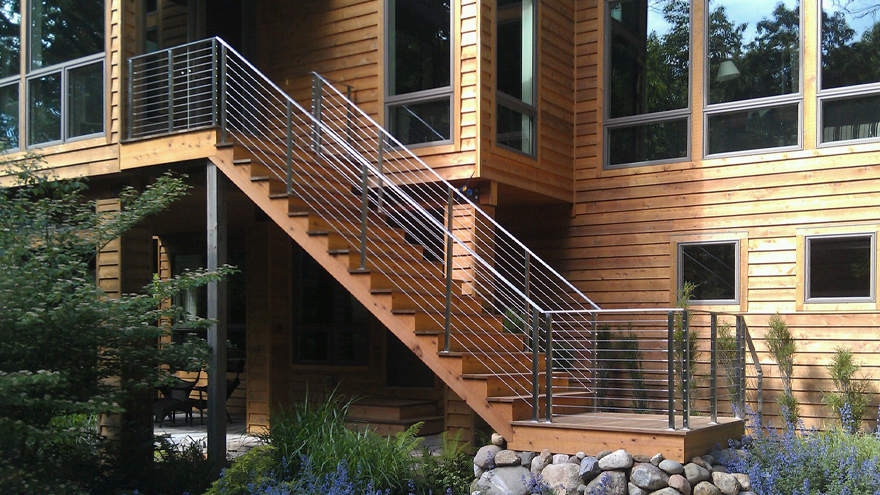 Cable railing on outside staircase. The exterior stair cable rail is made from stainless steel.