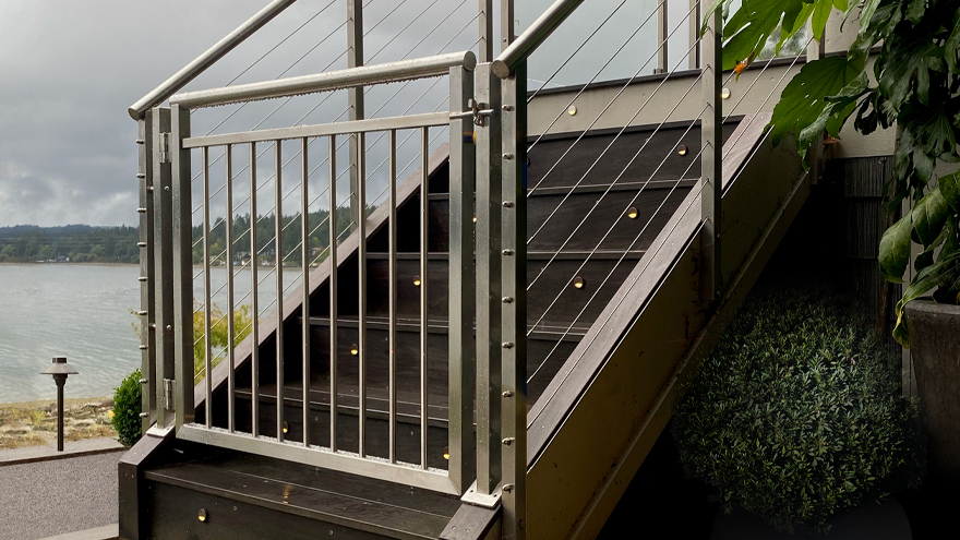 Beautiful stainless gate for stair railing system.