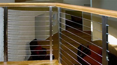 This winder stair cable railing remodel in Atlanta, Georgia, is one of our favorite railing projects.