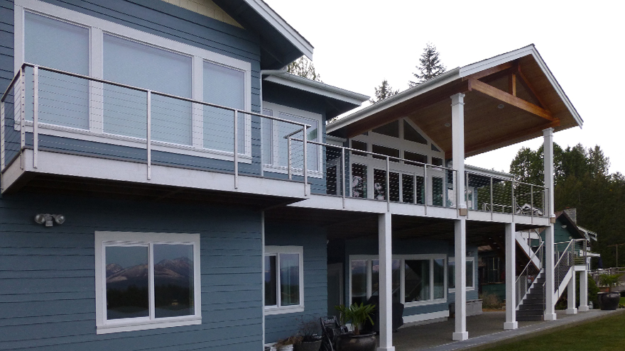 Deck, balcony and stair railing, installed using the notched decking edge method.