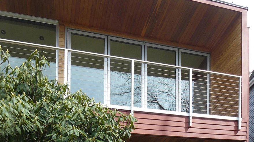 Balcony cable railing with side mount railing posts.