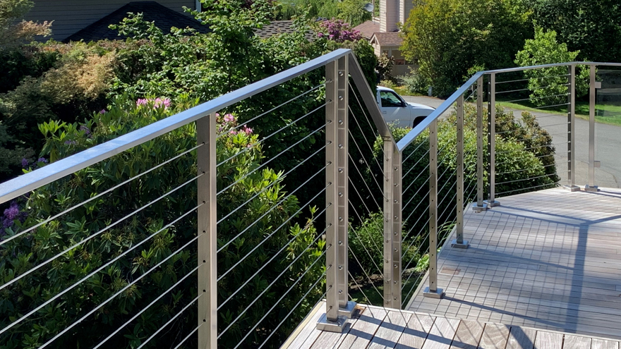 Stainless steel cable railing otherwise known as wire railing, on stairs and deck.