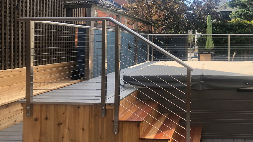 Cable railing on steps exiting jacuzzi.