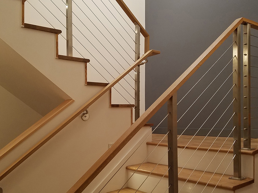 Beautiful switchback stairs with cable railing.