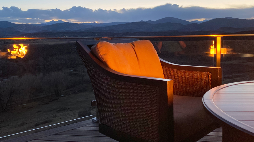 Elegant glass railing system on deck looks out on the beautiful colorado terrain.