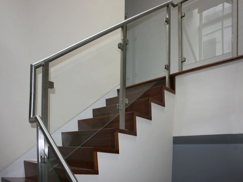 Glass panel railing with gooseneck handrail.