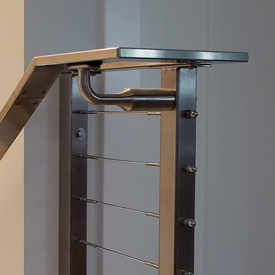 A bracket mounted to the railing post is used to install stair handrail.