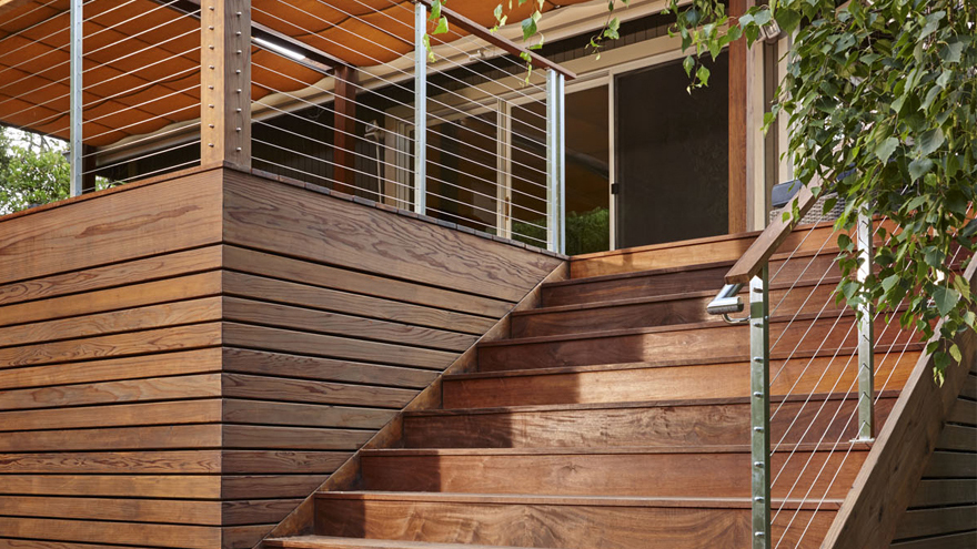Back porch stair railing with double handrail detail.