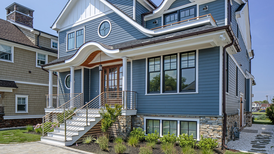 Horizontal porch railing on steps and entry way is a beautiful modern railing for the home.