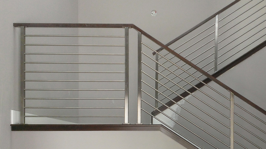 Horizontal bar railing on switchback stairs.