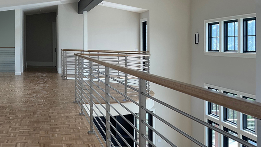 Stainless steel rod railing for radius balcony. Custom railing installation in Charleston SC.