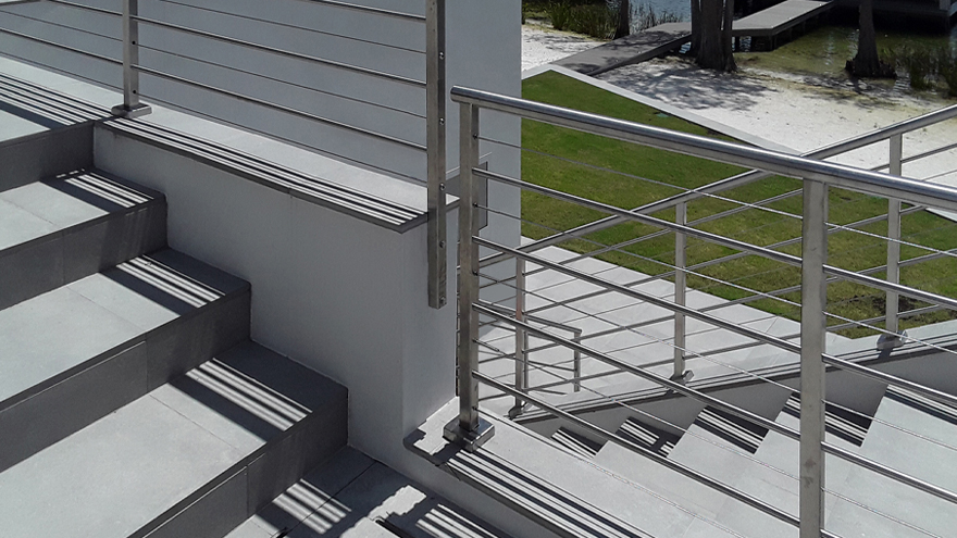 A railing install with surface mount posts, side mount posts and angled top mount posts was custom-build for this unique luxury property. Top mount vs. side mount posts - a well designed railing should allow you to switch between the options as needed.