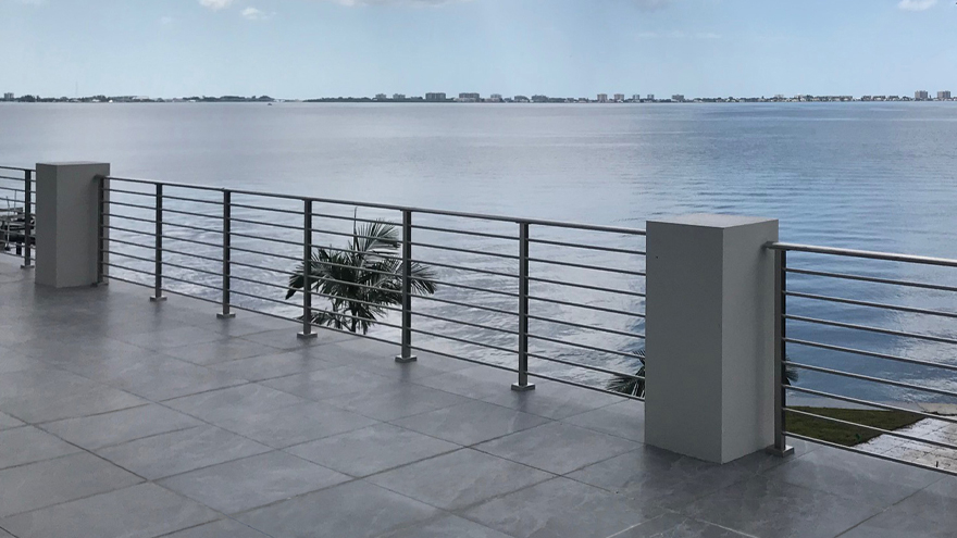 Tubular or rod railing has a classic yet modern railing look. Horizontal rod railing or vertical rod railing are fantastic railing styles for patios and decks.