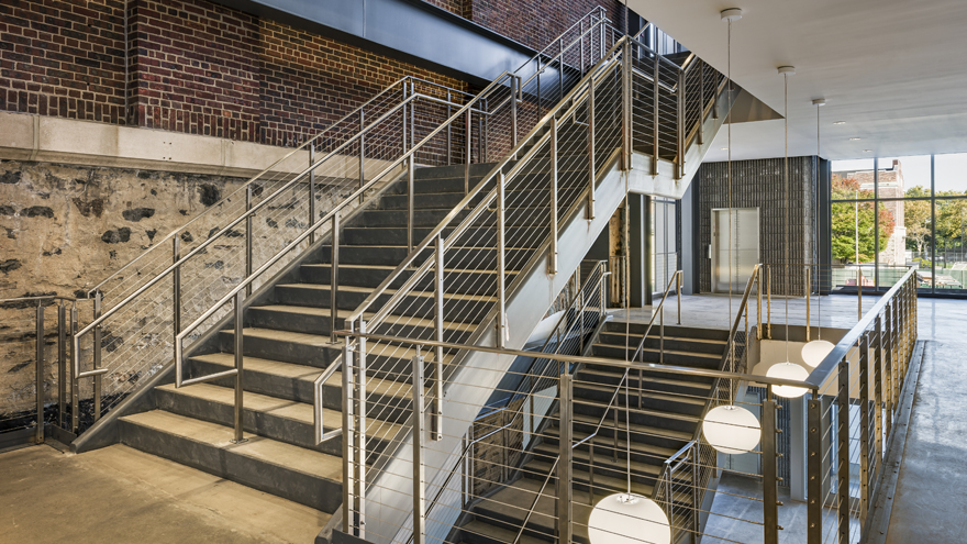 Cable commercial stair rail looks amazing. The double handrails, switchback stairs and elegant posts create a modern beautiful cable stair railing.