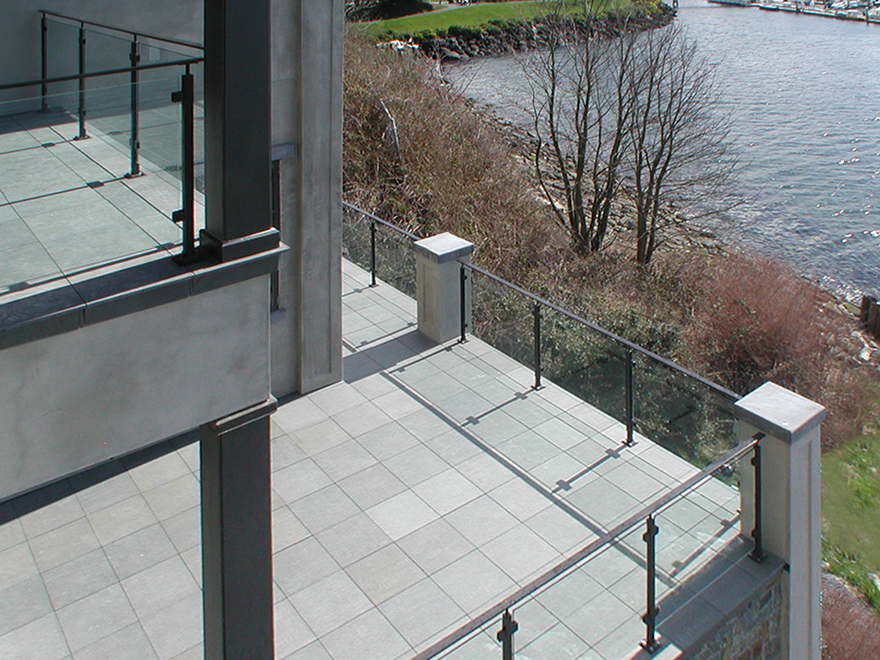 Black glass railing for balcony and glass deck railing create a cohesive look. Glass panel deck railing is easy to maintain.