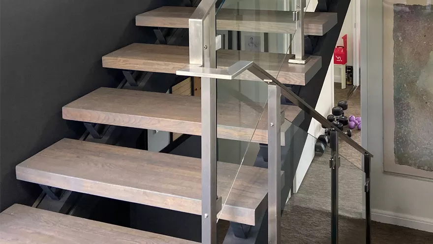 Staircase railing ideas for a modern staircase include floating stairs or an-open staircase.