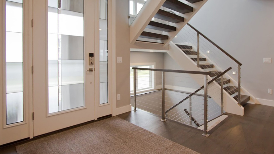 Cable stair railing and open staircases are beautiful modern staircase designs for basement stairs and staircase remodels.