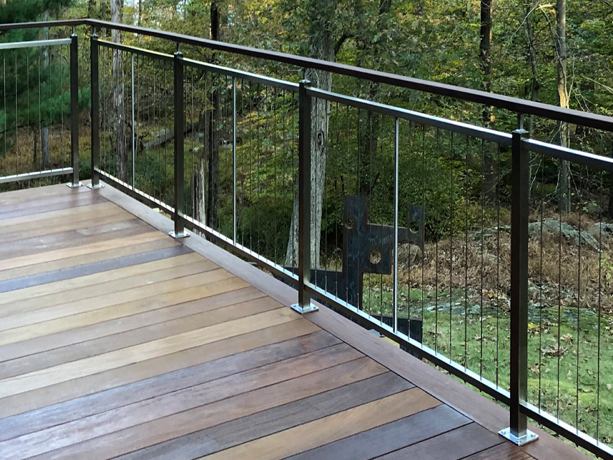 Vertical deck balusters made from stainless steel are a beautiful addition to a custom home.